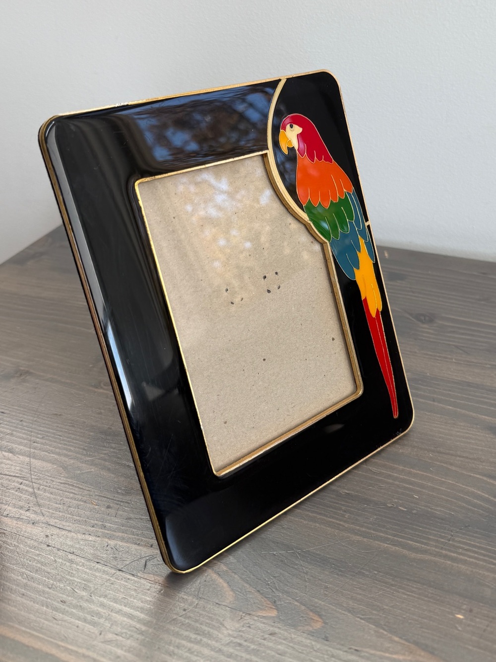 Vintage gloss black frame with inlaid parrot